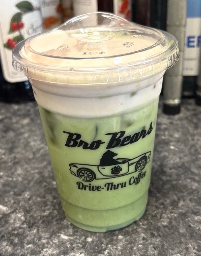 Iced green matcha-style drink in a branded Bro Bears cup